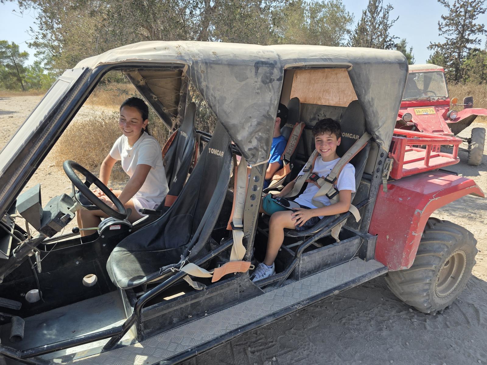Children in a Tomcar on the farm